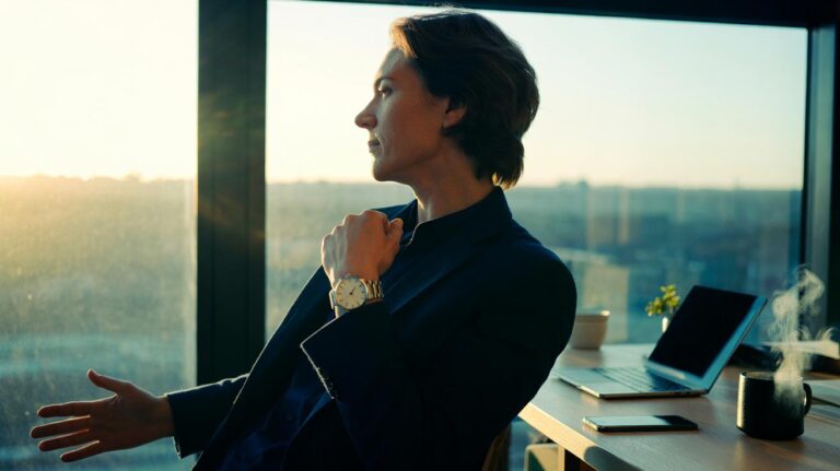 Illustration of a one-minute reset: a person taking a brief micro-break with paced breathing to reduce irritability and regain focus